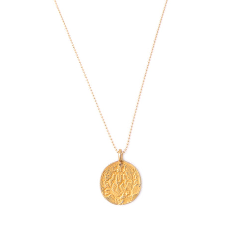 gold coin pendant